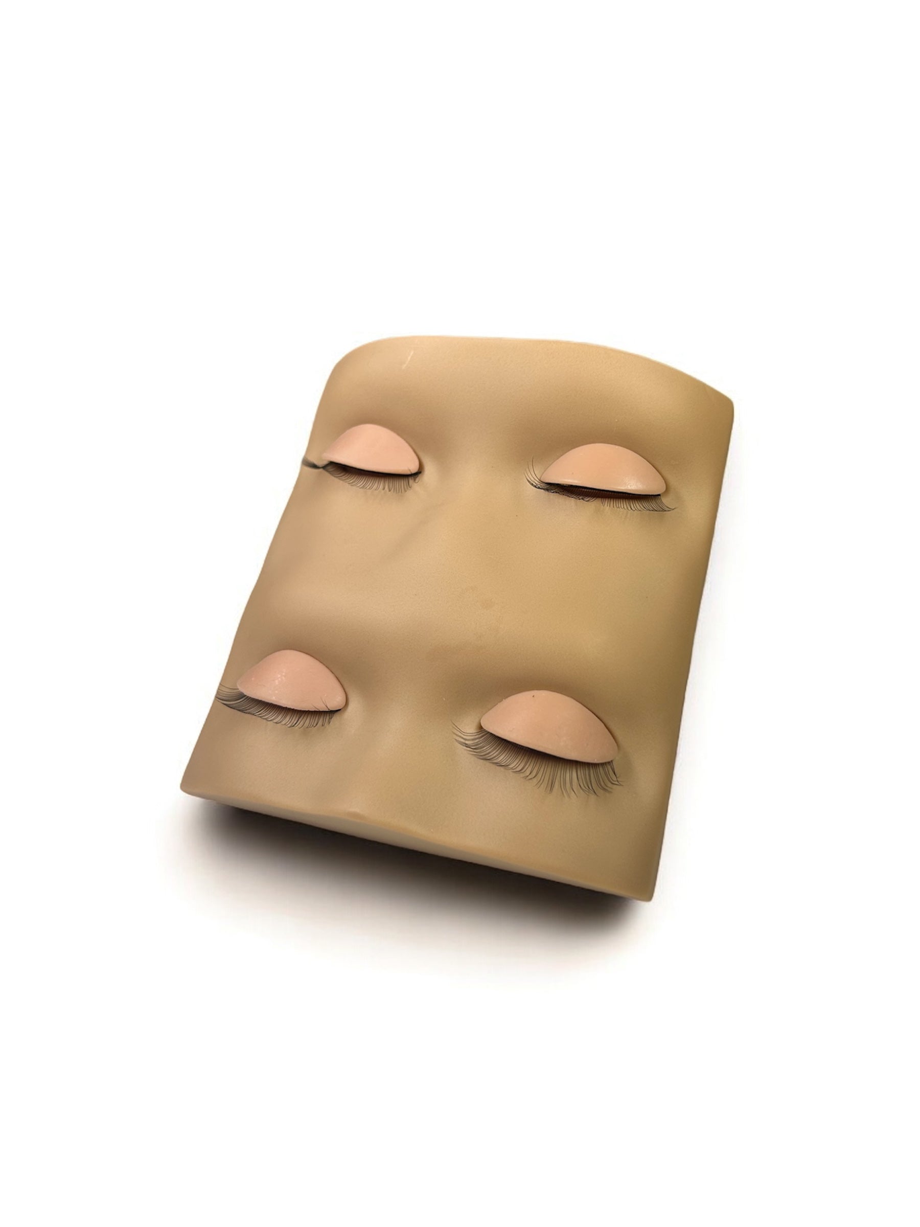Upgraded lash training mannequin head with four reusable practice eyes featuring pre-attached lashes for realistic lash extension practice.